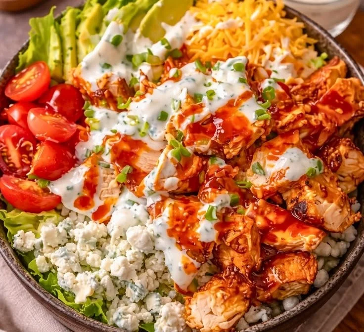 Buffalo Chicken Protein Bowl with vibrant veggies and spicy sauce