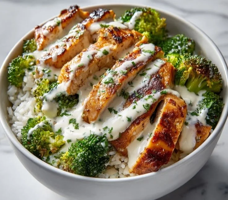 Delicious creamy garlic chicken with broccoli served in a cozy bowl.