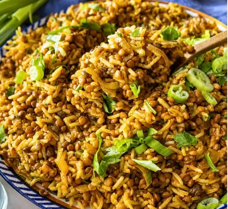 A bowl of easy Mediterranean lentils and rice garnished with herbs.