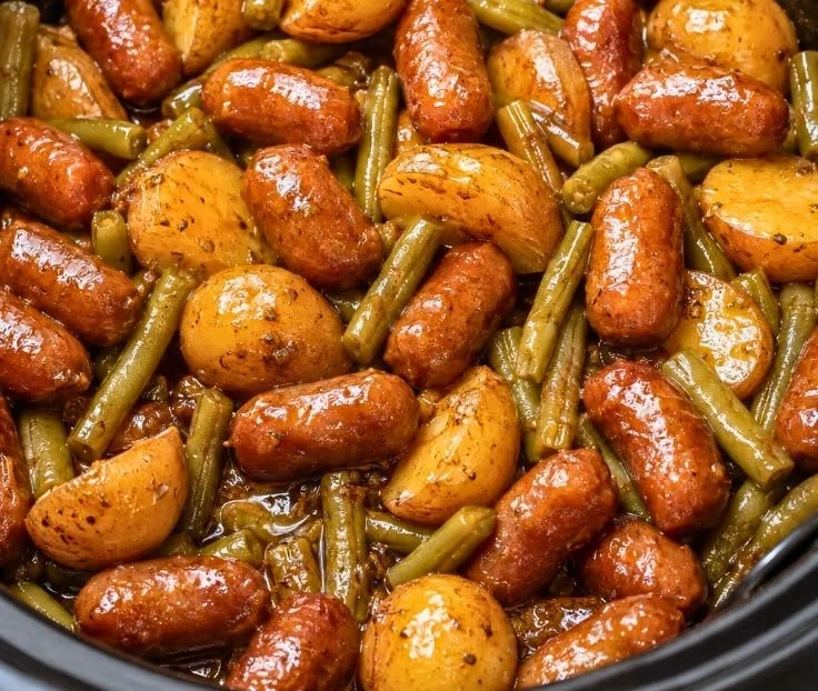 Crockpot beef sausages with potatoes and green beans in a slow cooker