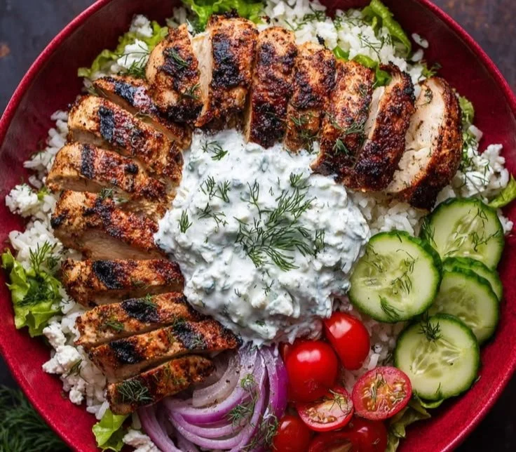 Greek Chicken Bowl with lemon-herb chicken, yogurt sauce, and fresh vegetables