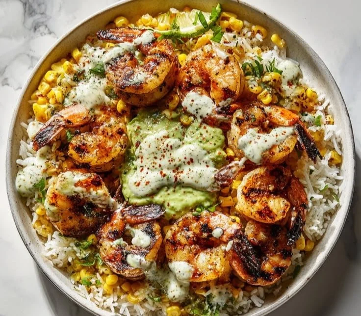 Grilled shrimp bowl with avocado corn salsa in a colorful presentation