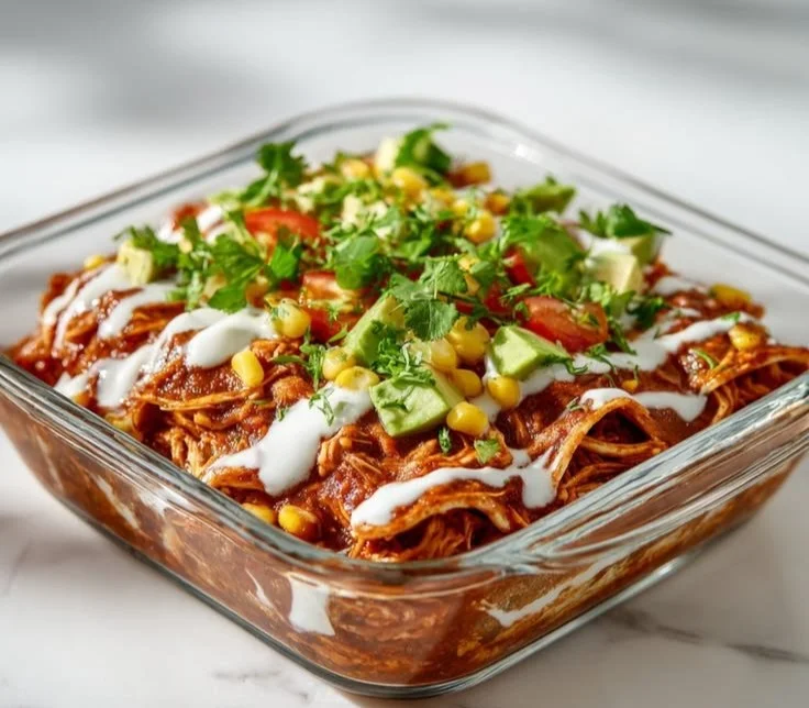 High-protein chicken enchilada bowl with vibrant toppings