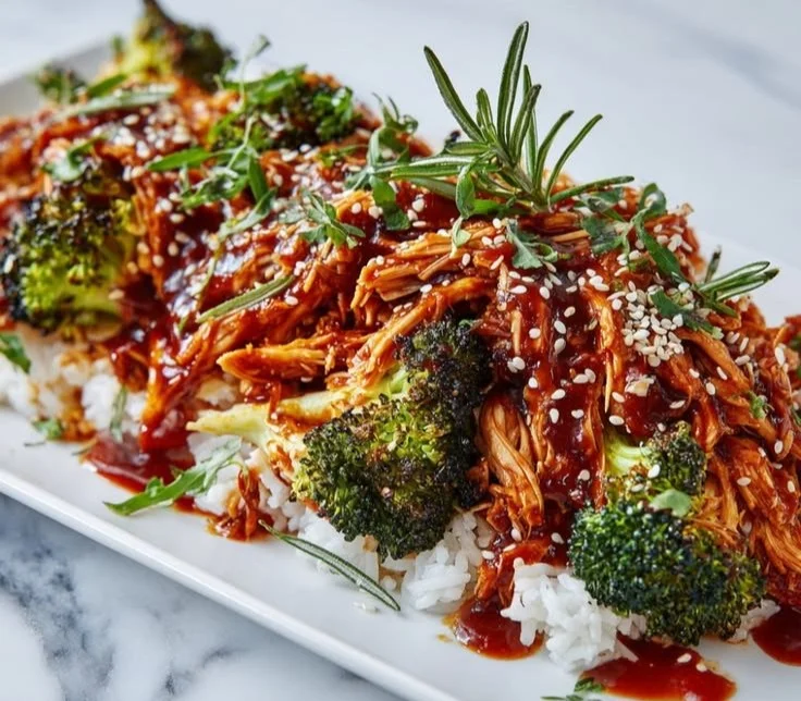 Healthy high-protein shredded chicken bowls with various toppings