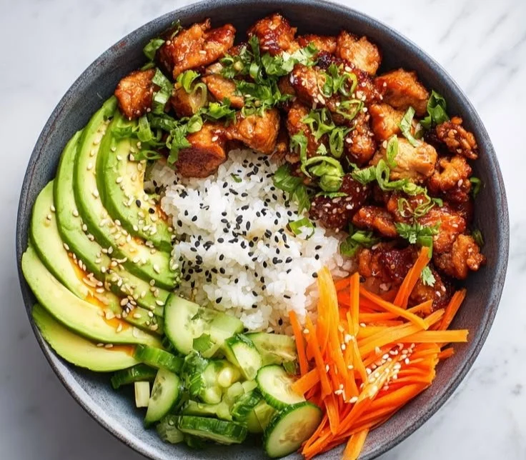 Hot Honey Chicken Bowl with colorful vegetables and a drizzle of honey sauce