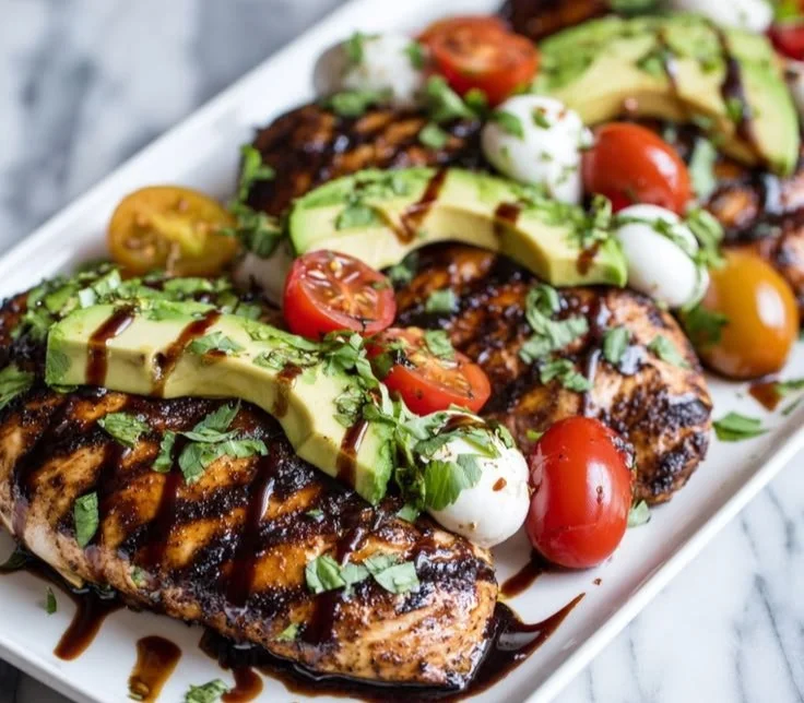 Grilled California avocado chicken garnished with fresh ingredients