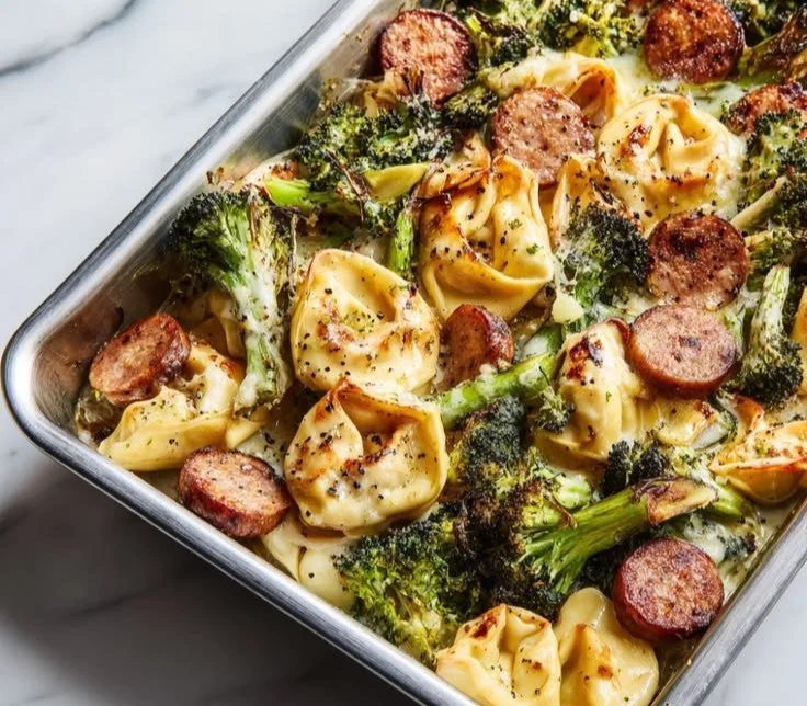 Delicious sheet pan broccoli tortellini bake cooked to a crispy perfection