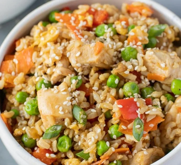 Healthy fried rice with chicken and vegetables in a bowl