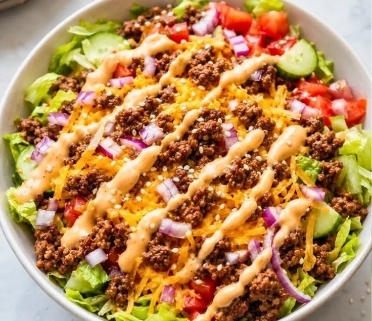 High-protein cheeseburger bowl with special sauce and fresh ingredients