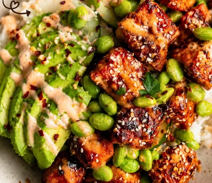 Delicious Honey Sriracha Salmon bowl garnished with fresh vegetables