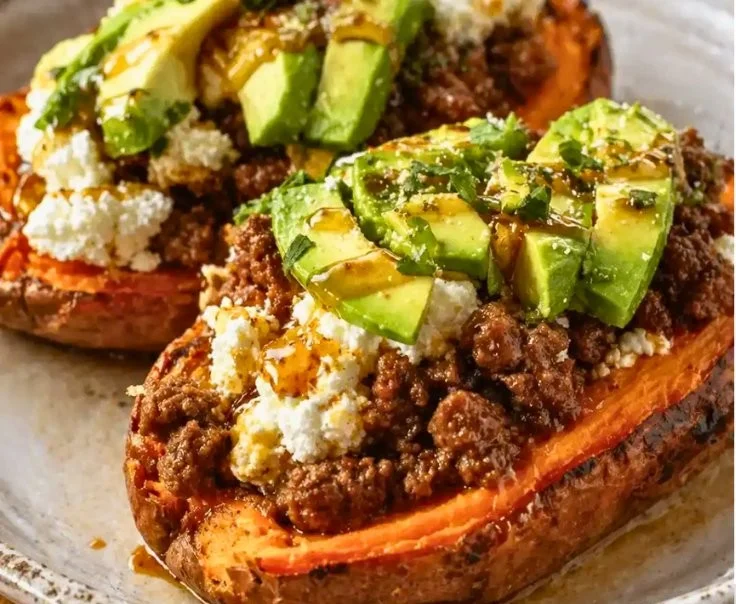 Delicious Hot Honey Beef Sweet Potato Boats topped with cottage cheese for a hearty meal.