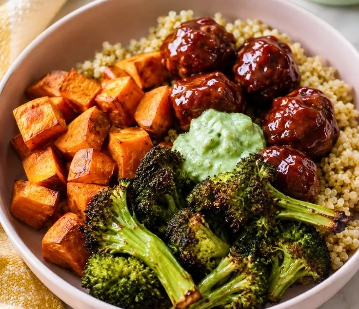 Delicious BBQ meatball bowls topped with sauce and served in a colorful bowl